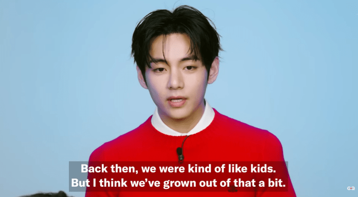 BTS V speaking in front of a blue background, wearing a red sweater, with subtitles displaying their thoughts about growth and maturity.