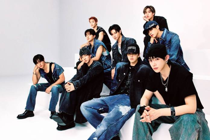 The boyz posing together in casual denim outfits against a plain background, showcasing various expressions and styles.