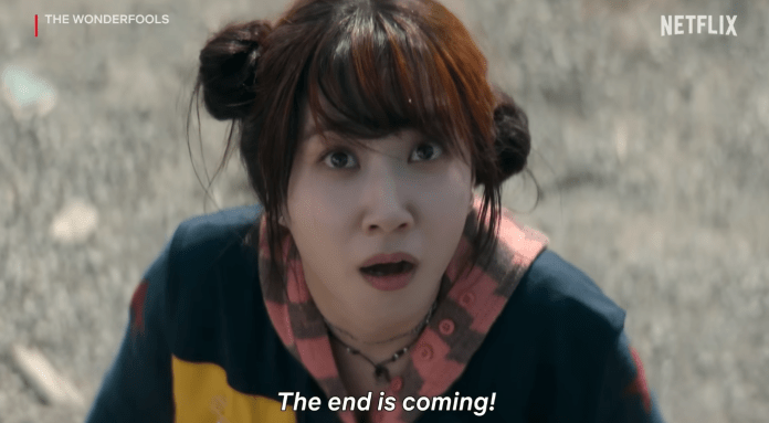 A startled Park Eun-bin with two buns in her hair looks up with wide eyes, expressing alarm as she exclaims, 'The end is coming!'