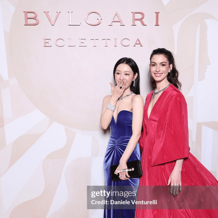 Kim Ji-won posing at a Bvlgari event, one in a blue dress with sparkling jewelry and the other in a red gown, smiling in front of a branded backdrop.
