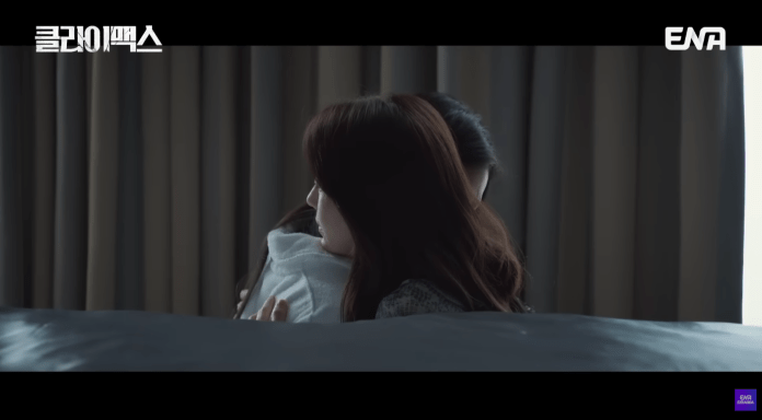 Ha Ji-won and  Han Dong-hee  embracing each other in a heartfelt moment, with a soft focus on their faces and a backdrop of curtains.