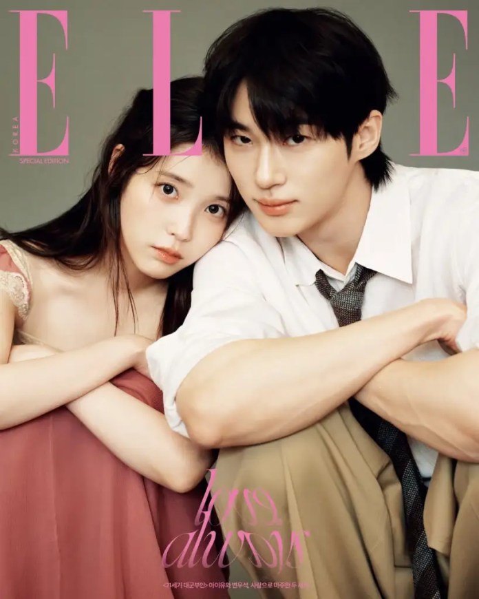 Cover of Elle Korea Special Edition featuring IU in a pink dress and Byeon Woo-seok in a white shirt and tie, both appearing close together with a neutral background.
