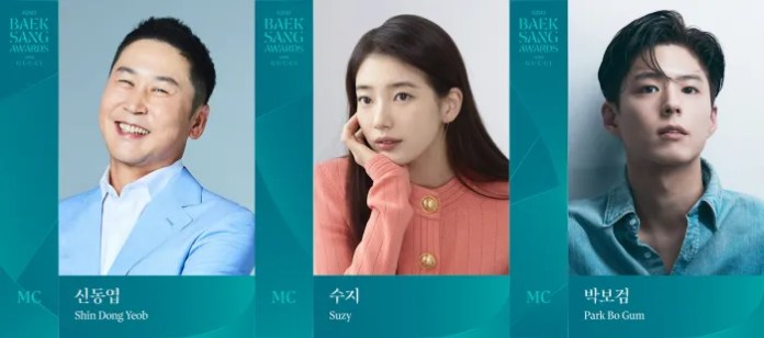 Promotional image for the 2023 Baeksang Awards featuring three hosts: Shin Dong Yeob, Suzy, and Park Bo Gum.