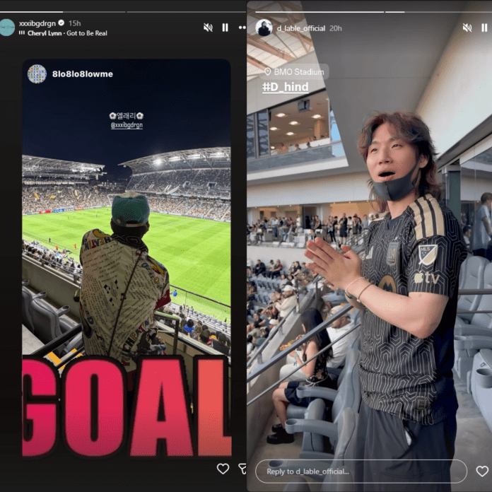 G-Dragon in a colorful outfit stands in a stadium, watching a soccer game with excitement, as the word 'GOAL' is prominently displayed. Daesung is standing up and clapping cheerfully while being dressed in a football jersey