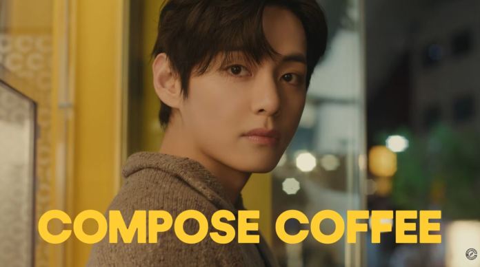 BTS V with dark hair is looking over his shoulder towards the camera, with the phrase 'COMPOSE COFFEE' prominently displayed in bold yellow letters.