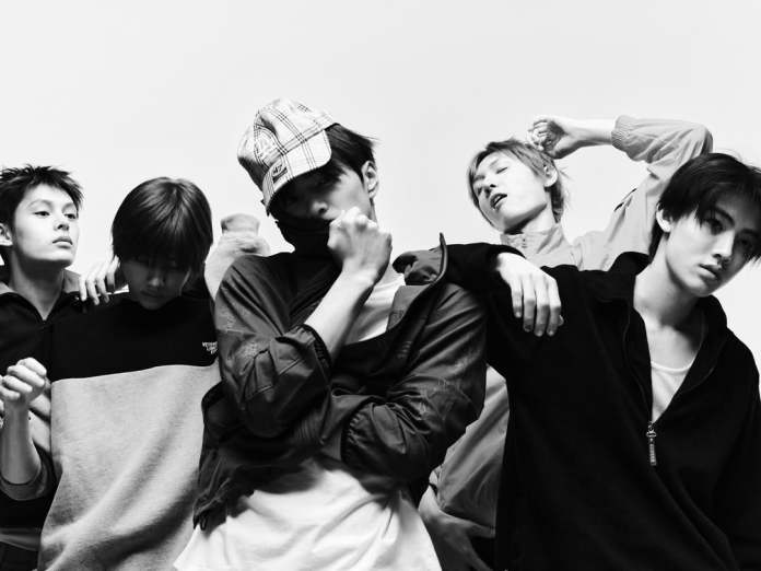 CORTIS members posing together in a monochrome setting, showcasing various fashion styles and expressions.