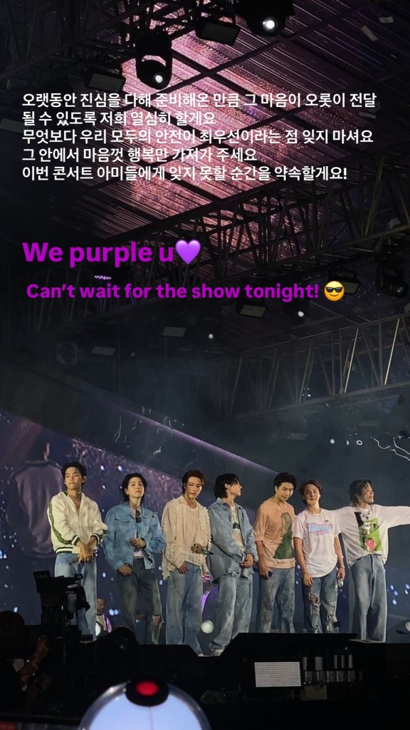 BTS standing on stage with a vibrant backdrop during a concert, showing excitement and anticipation for the event.