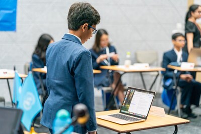 A student delegate engaging during the International Model United Nations Conference at NLCS (Singapore), alongside peers from across the NLCS family of schools.