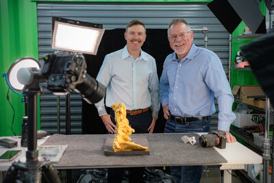 Garrett Hoyer and his father, Erik Hoyer, pose with the Boot of Cortez, the largest surviving natural gold nugget found in the Western Hemisphere. Erik Hoyer is the CEO and owner of EJ's Auction & Appraisal in Glendale, Arizona. The full-service auction house will auction the Boot of Cortez on Friday, June 12, 2026. Bidders can register through June 9 at bootofcortez.com. Photo credit - Jeff Noble/jeffnoblepictures.com 