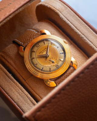 Lot 23 — Patek Philippe Ref. 2549/1J - 1954 Patek Philippe Ref. 2549/1J "Turtle Lugs" in 18-carat yellow gold with silver guilloché tropical dial, one of only eight known examples