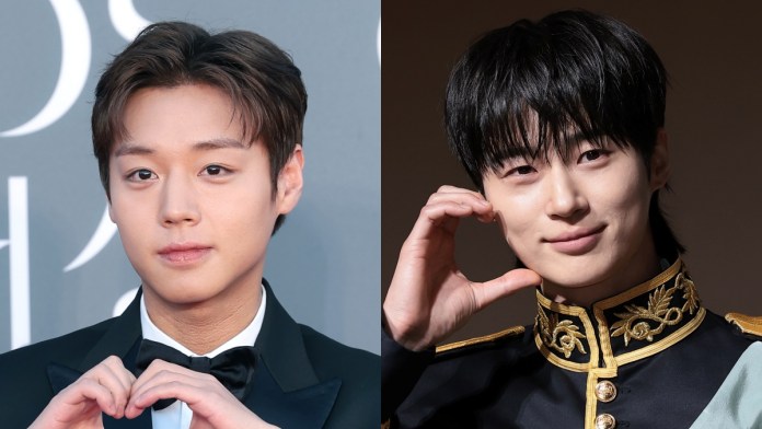 A split image featuringPark Ji-hoon and Byeon Woo-seok making heart shapes with their hands. Park Ji-hoon on the left is dressed in formal attire, while Byeon Woo-seok on the right is in an ornate costume.