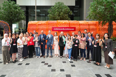 J&J leaders with patient advocacy leaders at a preview tour of the Gut Tunnel.