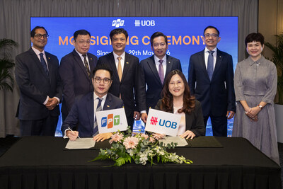 Ms Gillian Chua, Head of Strategic Alliances and Sourcing, Group Technology and Operations, UOB (seated right) and Mr David Nguyen, CEO of FPT Asia Pacific, FPT Corporation (seated left) signed an MoU on 29 May 2026 to advance AI, technology transformation and financial innovation. The MoU signing was witnessed by Mr Lawrence Goh, Head of Group Technology and Operations, UOB (standing, fourth from left) and Mr Nguyen Van Khoa, Group CEO, FPT Corporation (standing, third from left).