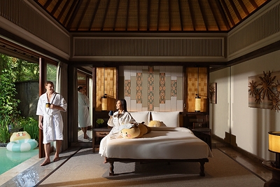 Couple enjoying coffee in Kakao Friends Garden Pool Villa at Andaz Bali, by Hyatt