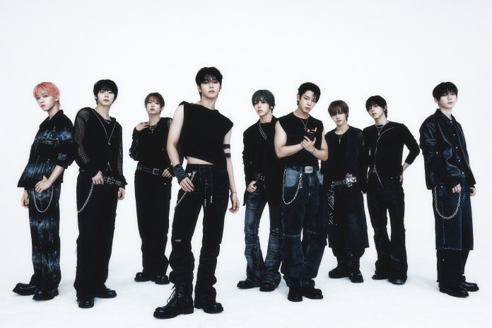 A group of nine individuals posing in stylish black outfits against a plain white background, showcasing a mix of casual and edgy fashion.