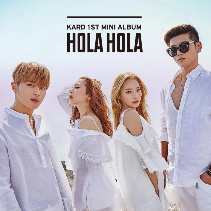 KARD 1st mini album 'HOLA HOLA' promotional image featuring four members dressed in white, standing against a beach backdrop.