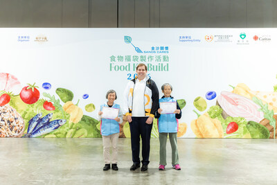 Patrick Dumont (centre), chairman of the board and chief executive officer of Las Vegas Sands Corp., and chairman of the board and non-executive director of Sands China Ltd., presents community service certificates to two elderly volunteers aged over 80 of Carita Macau, in recognition of their dedication to serving the community. (PRNewsfoto/Sands China Ltd.)