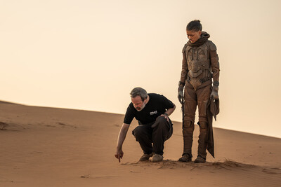 (L-r) Director/Writer/Producer DENIS VILLENEUVE and Zendaya on the set of Warner Bros. Pictures and Legendary Pictures’ action adventure “DUNE: PART THREE,” in the Liwa Desert, Abu Dhabi. A Warner Bros. Pictures release. Photo by Niko Tavernise. (L-r) Director/Writer/Producer DENIS VILLENEUVE and Zendaya on the set of Warner Bros. Pictures and Legendary Pictures’ action adventure “DUNE: PART THREE,” in the Liwa Desert, Abu Dhabi. A Warner Bros. Pictures release. Photo by Niko Tavernise.