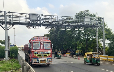 Vehicles travel beneath FETC International's AI-powered Multi-Lane Free Flow (MLFF) electronic toll collection (ETC) gantries at the Choryasi Fee Plaza on NH-48 in Gujarat, India, enabling barrier-free toll transactions without requiring vehicles to stop.