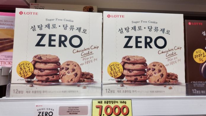 Two boxes of Lotte Sugar Free Chocolate Chip Cookies labeled 'ZERO' displayed on a supermarket shelf. Each box contains 12 cookies.
