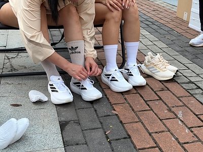 Runners trying on the new ZENBOOST shoes at the event in Kuala Lumpur.
