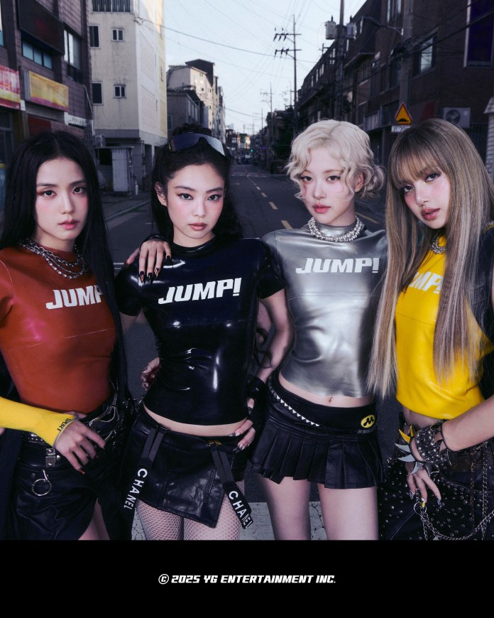 Four women posing confidently in a street setting, wearing stylish outfits with bold colors and text, showcasing a modern and urban aesthetic.