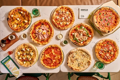 Goodfellas Pizzeria, the warmth of wood-fired pizza meets the vibrant atmosphere of Patong Beach