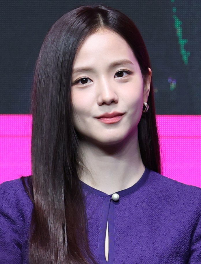 Jisoo with long, straight dark hair, wearing a purple dress, and a subtle smile against a colorful background.