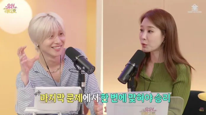 Taemin engaged in a lively discussion on a podcast.