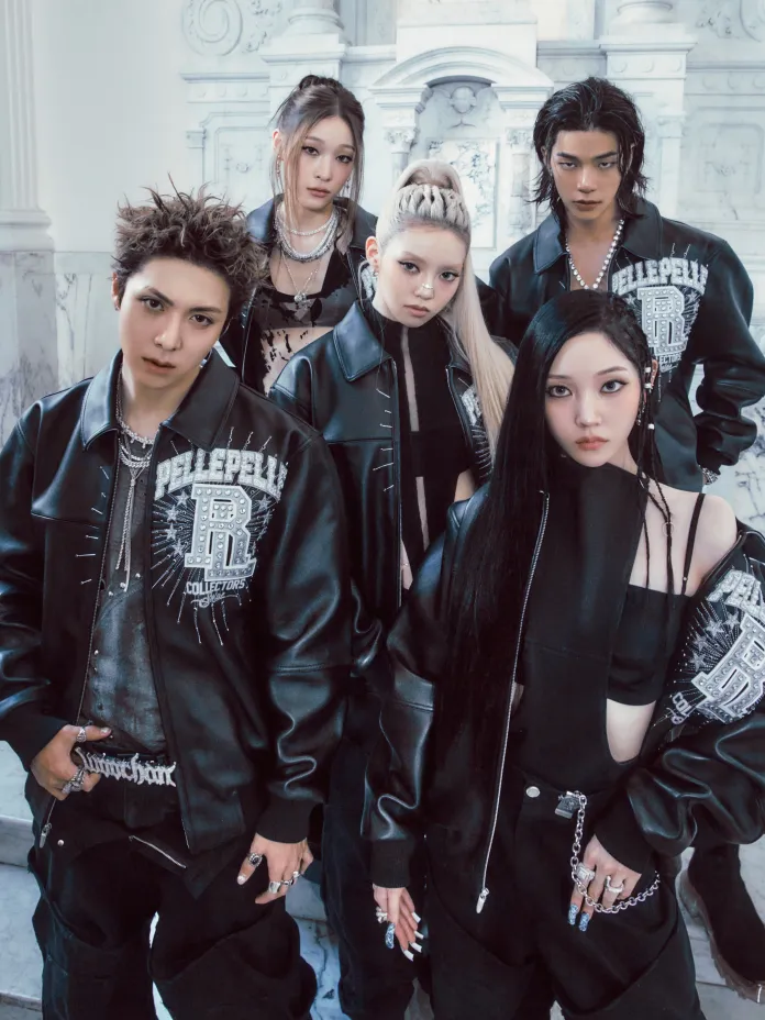 A group of five young individuals posing together in edgy fashion, wearing black leather jackets and stylish accessories, set against a marble backdrop.