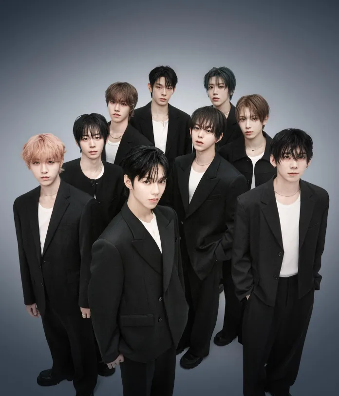 AHOF posing together, all dressed in black suits and white t-shirts, against a gradient gray background.
