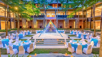 The Courtyard Garden at Courtyard by Marriott Bali Nusa Dua Resort offers outdoor setup with lush tropical greenery and Balinese warm hospitality