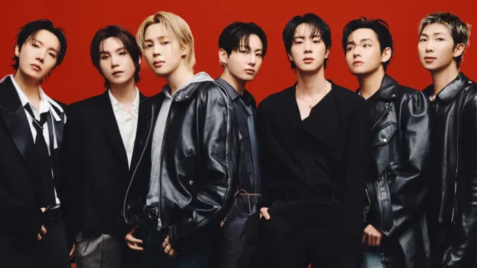 BTS in stylish dark outfits, posing against a red background. They are showcasing various expressions and styles, with a mix of leather jackets and formal wear.