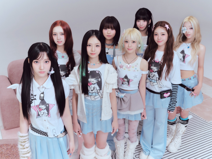 UNIS posing together, all wearing stylish outfits in shades of blue and white, featuring graphic prints and accessories, in a bright studio setting.