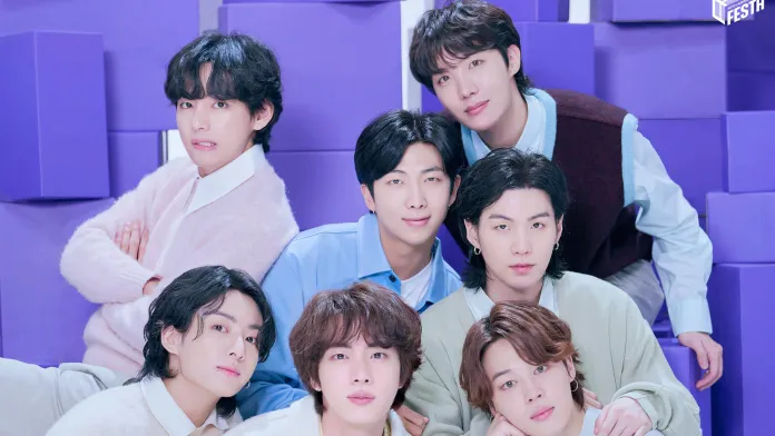 BTS posing together in a brightly colored studio setting, with purple geometric shapes in the background.