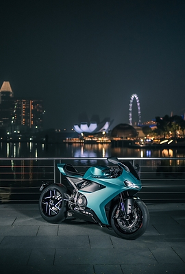 The Red Dot: Best of the Best-winning Norton Manx R pictured against Singapore’s Marina Bay skyline.
