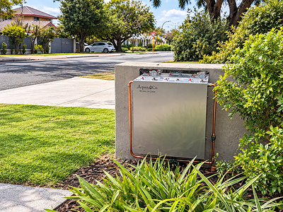 An AquaCo water filtration system installed at the front of an Australian home for complete home filtration.