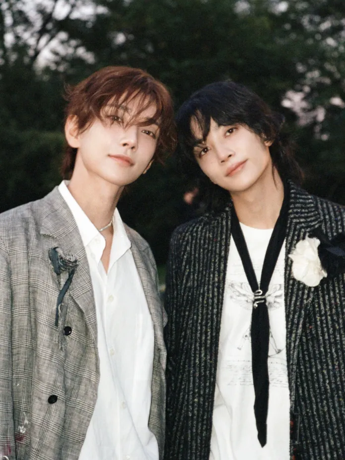 Jeonghan and Joshua posing together outdoors, wearing stylish outfits with a relaxed vibe, surrounded by greenery.