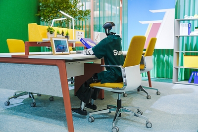 A forward-looking workplace scene at SUNON’s ORGATEC 2026 exhibition imagines how people and robots may share future working environments.