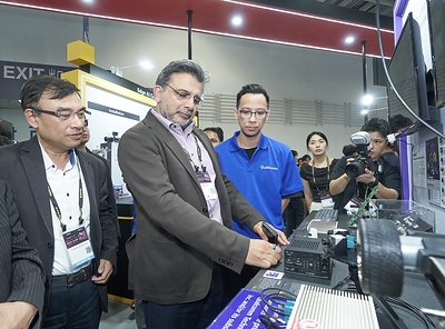 Nakul Duggal, Executive Vice President at Qualcomm, greets Randy Chien, Chairman of Innodisk at Innodisk booth during Computex 2026