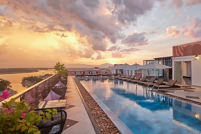 The Art Nouveau-inspired rooftop pool overlooking the Thu Bon River at Hotel Royal Hoi An – The Legacy By The River. The Art Nouveau-inspired rooftop pool overlooking the Thu Bon River at Hotel Royal Hoi An – The Legacy By The River.
