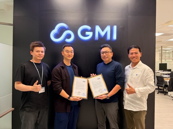 Four individuals pose in front of a GMI logo, holding signed documents as part of a collaboration announcement between Compal and GMI Cloud