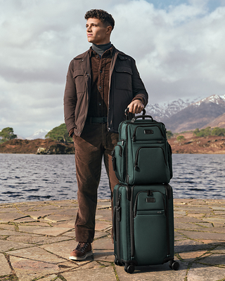 Lando Norris pictured with the Alpha TUMI Brief Pack and Alpha Dual Access Expandable 4 Wheeled Carry-On Lando Norris pictured with the Alpha TUMI Brief Pack and Alpha Dual Access Expandable 4 Wheeled Carry-On