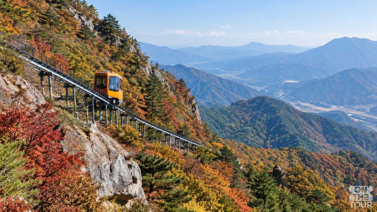 함양 대봉산 산허리를 따라 모노레일이 단풍으로 물든 숲 사이를 지나고 있다. (AI 생성) / 온더투어